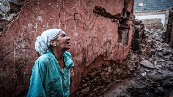 TOPSHOT - A woman reacts standing infront of her earthquake-damaged house in the old city in Marrakesh on September 9, 2023. A powerful earthquake that shook Morocco late September 8 killed more than 600 people, interior ministry figures showed, sending terrified residents fleeing their homes in the middle of the night. (Photo by FADEL SENNA / AFP) (Photo by FADEL SENNA/AFP via Getty Images)